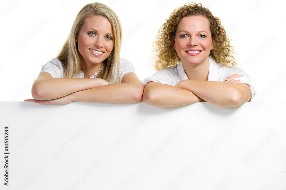Fototapeta premium two woman looking at a sign