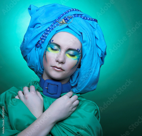 Young woman in blue turban