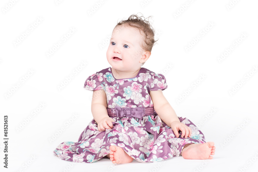 Beautiful baby girl in a purple dress Beautiful baby girl in a purple dress