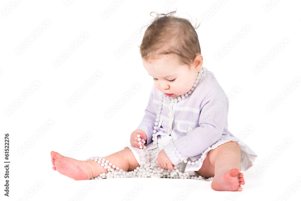 Cute baby girl playing with pearls Cute baby girl playing with pearls