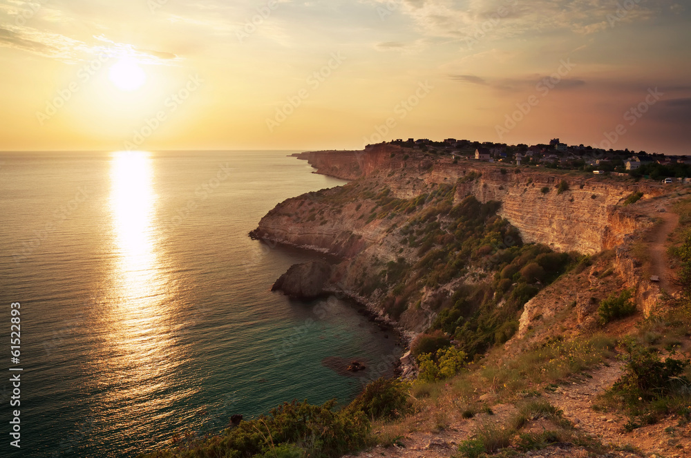 Sea and rock at the sunset. Nature composition Sea and rock at the sunset. Nature composition
