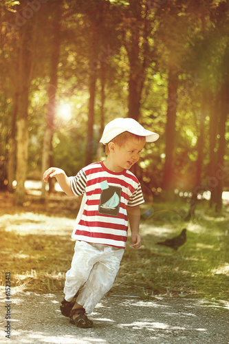 Little boy running in the park.
