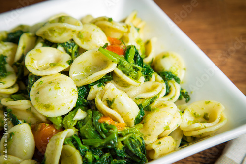 Orecchiette pasta with broccoli rabe and red pepper photo