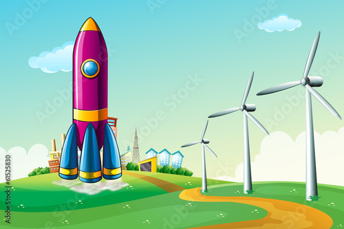 A hilltop with a rocket near the windmills