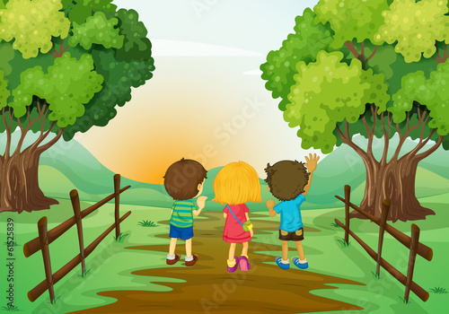 Three kids watching the sunset