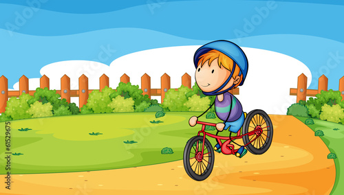 A young boy biking outdoor