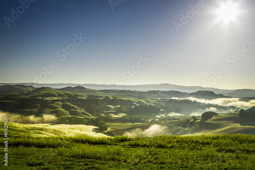 Misty hills in Tuscany at sunrise © shaiith