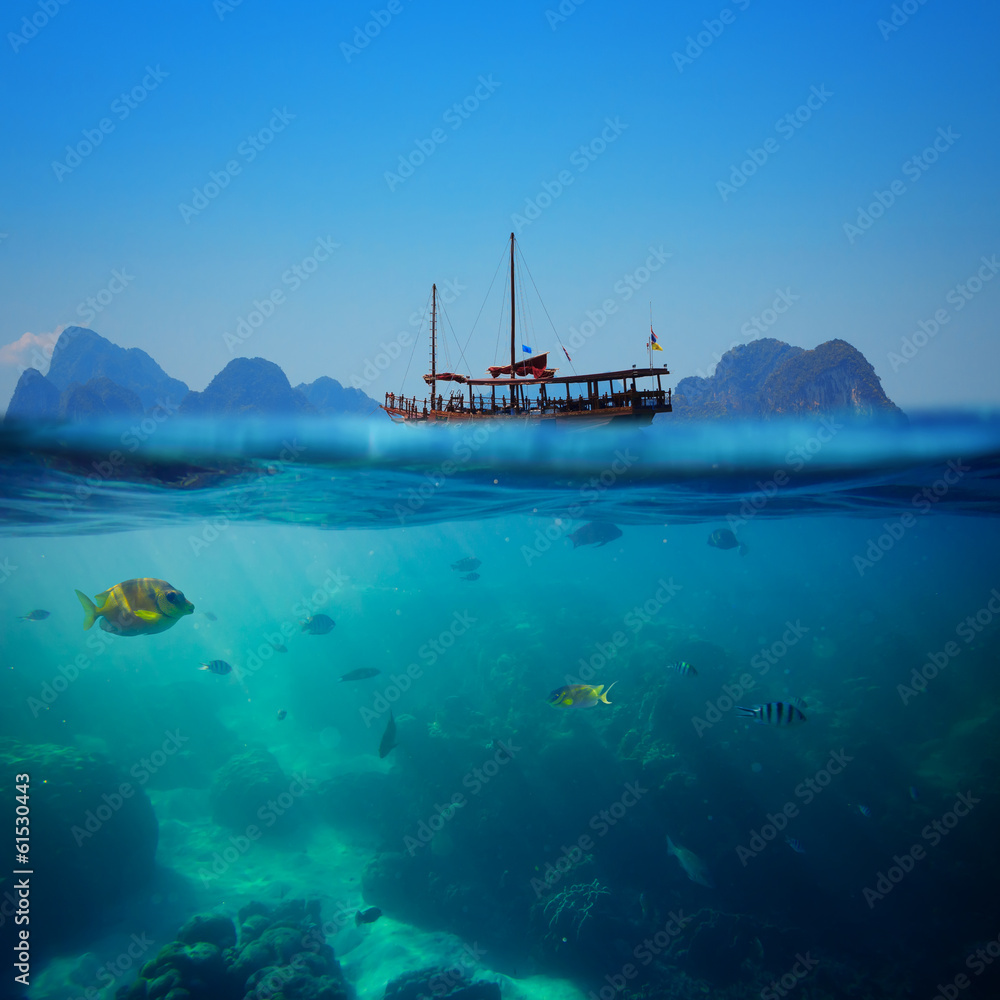 Tropical underwater shot splitted with ship and sky