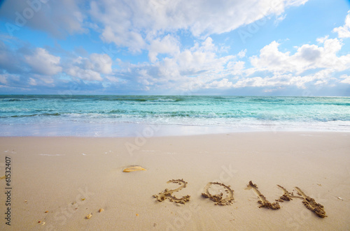 Year 2014 coming concept on beach © Mikhailov Studio