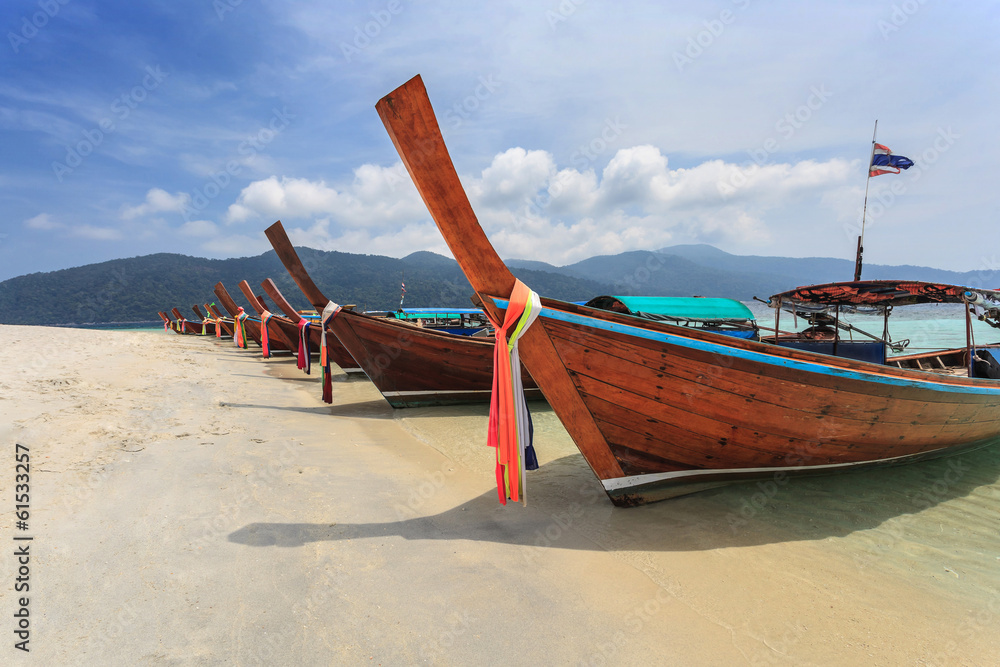 Longtail boat and beautiful beach of Koh Lipe, Thailand Longtail boat and beautiful beach of Koh Lipe, Thailand