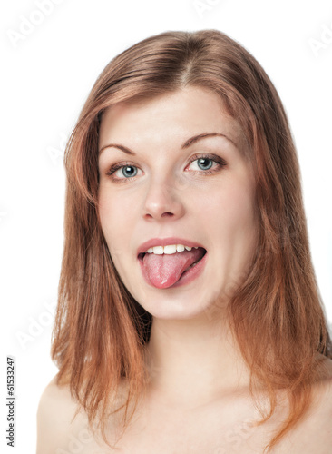 Beautiful young woman showing tongue