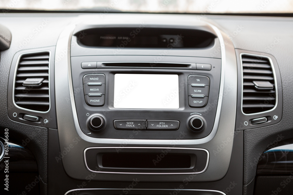 Panel of a modern car with a white screen multimedia system Panel of a modern car with a white screen multimedia system