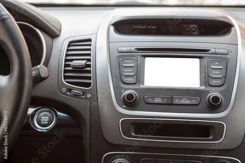 Panel of car with push-button start and white screen multimedia © Kekyalyaynen