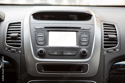 Panel of a modern car with a white screen multimedia system