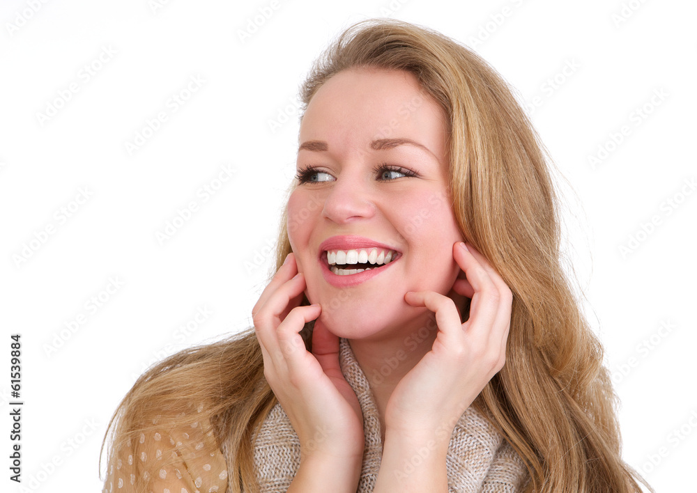 Young woman laughing with hands to face Young woman laughing with hands to face