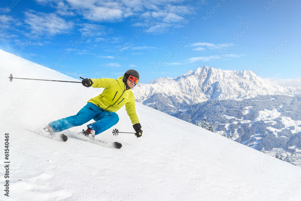Male skier with mountains - obrazy, fototapety, plakaty 