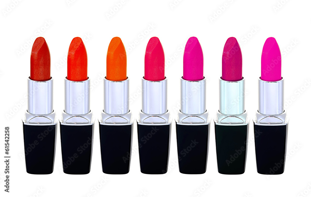 Set of red lipsticks isolated on white reflective background Set of red lipsticks isolated on white reflective background