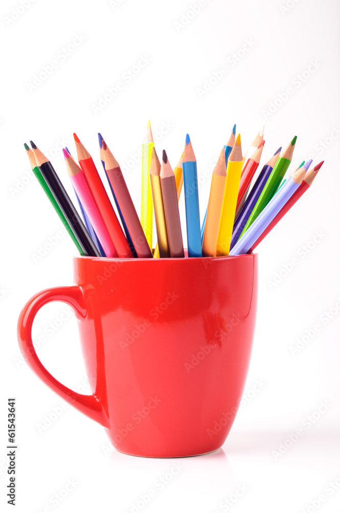 Color pencils in a red mug Color pencils in a red mug