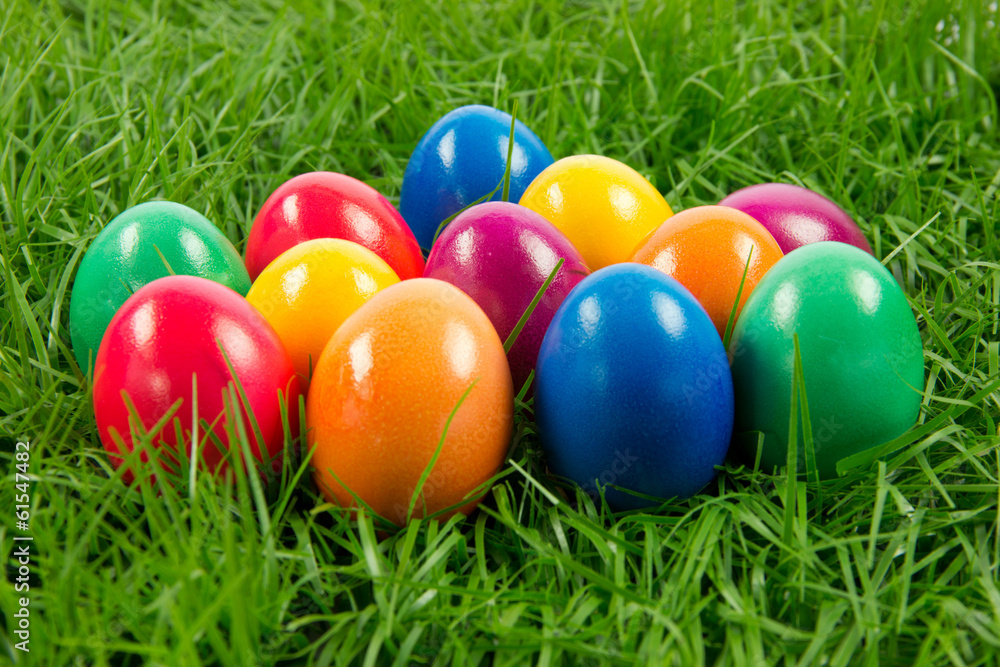 easter eggs in busket on green gras isolated