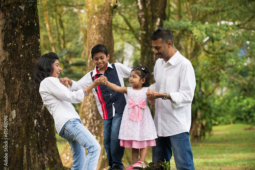 indian family teaching children to climb