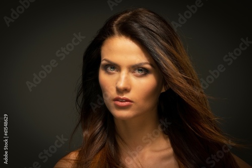 Seductive brunette woman with long hair