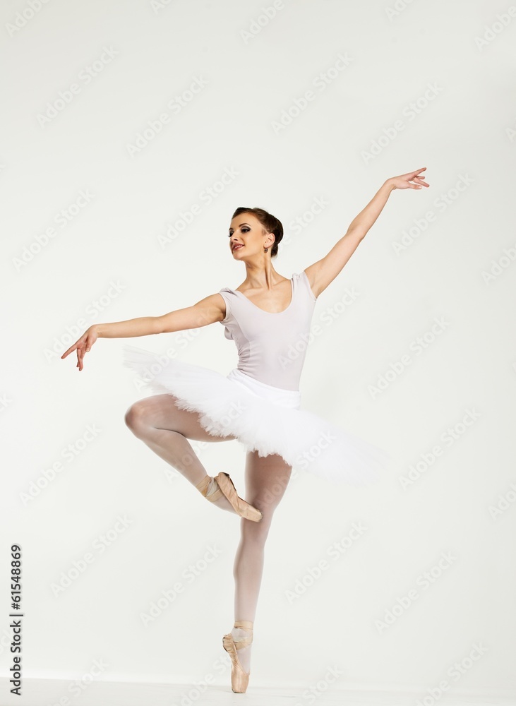 Young ballerina dancer in tutu showing her techniques Young ballerina dancer in tutu showing her techniques