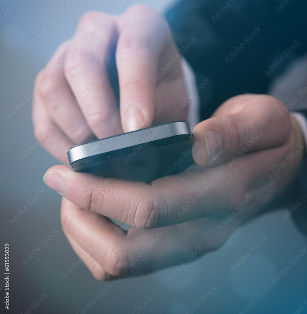 Hnad with mobile phone