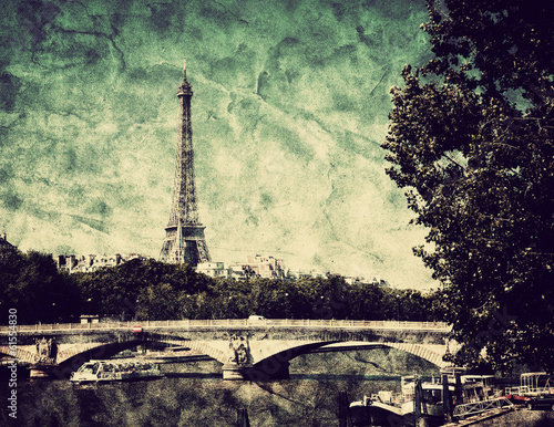 Eiffel Tower and bridge on Seine river in Paris, France. Vintage