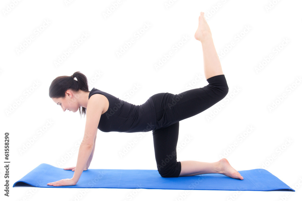 young attractive woman doing fitness exercise on blue yoga mat i young attractive woman doing fitness exercise on blue yoga mat i