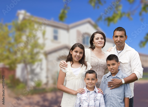 Hispanic Family in Front of Beautiful House © Andy Dean
