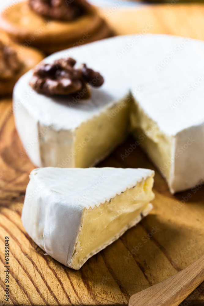 Camembert  cheese slice dipped with walnuts