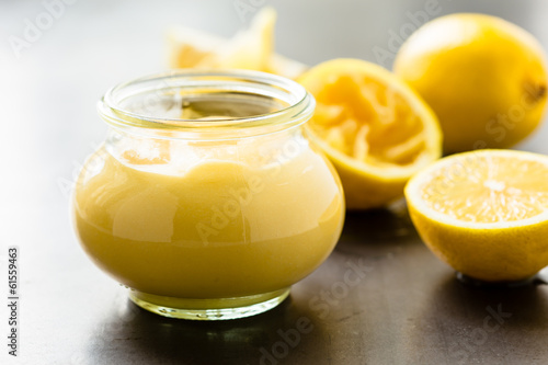 Leinwand Poster Homemade lemon curd in glass jar