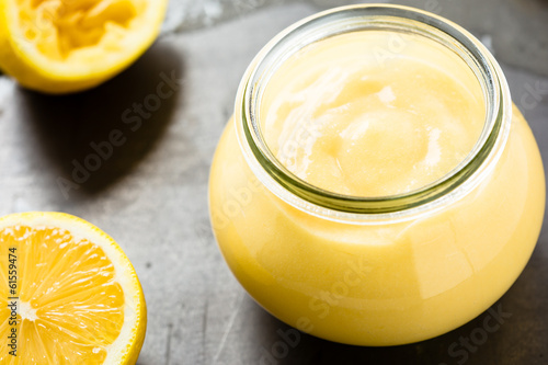 Homemade lemon curd in glass jar photo