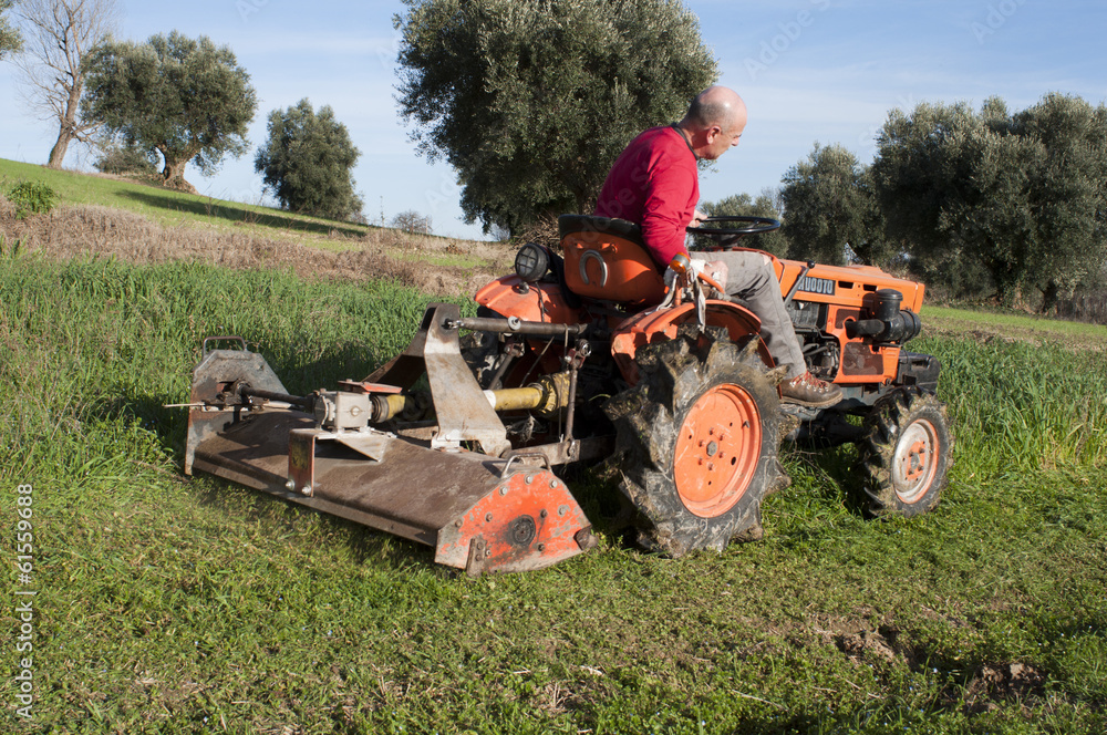 Obraz premium Tractor with mower
