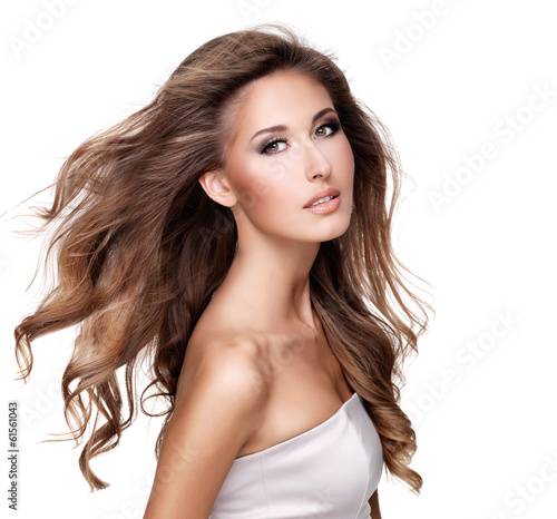A beautiful young woman with moving long wavy hair