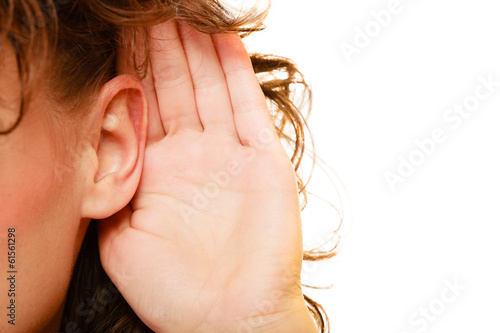 Part of head woman with hand to ear listening