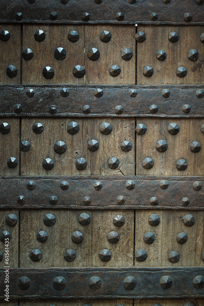 Old wooden background with metal rivets Old wooden background with metal rivets