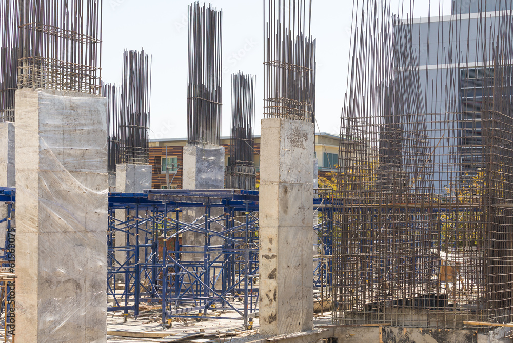 building cement pillar in construction site with blue sky