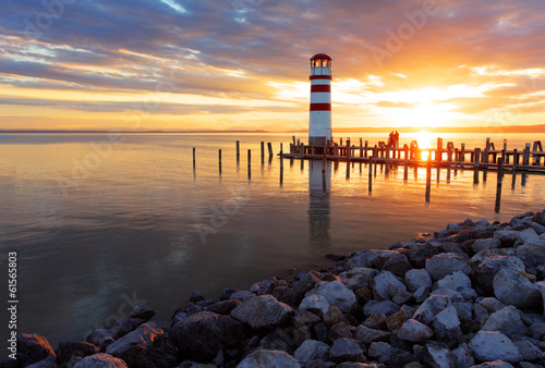 Fotografia, Obraz Ocean sunset with lighthouse