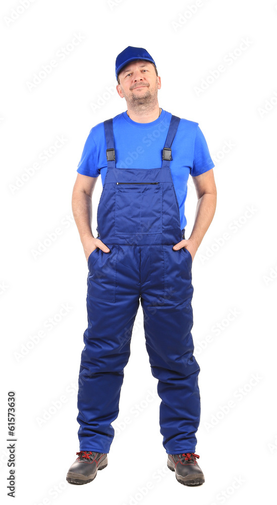 Worker with arms in pockets. Worker with arms in pockets.