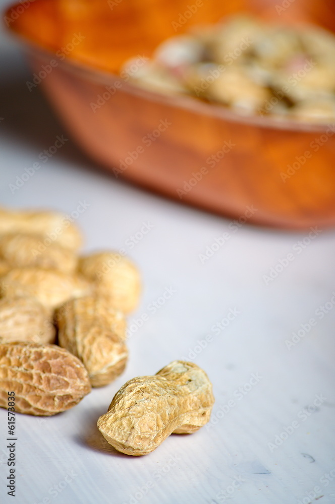 Peanuts in a brown bowl Peanuts in a brown bowl
