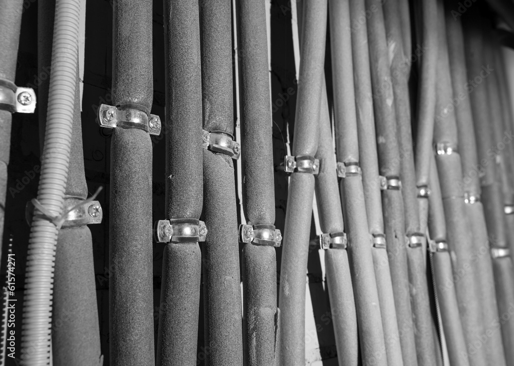 Protected wires on wall diagonal shot Protected wires on wall diagonal shot
