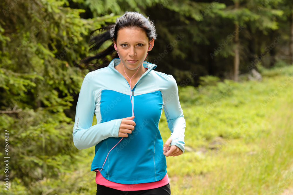 Running woman in forest fitness training Running woman in forest fitness training