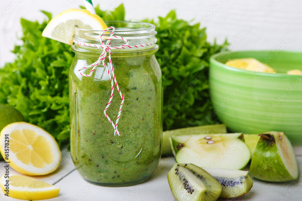 Fresh organic green smoothie with salad, apple, cucumber, pineap Fresh organic green smoothie with salad, apple, cucumber, pineap