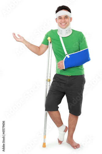 male with broken arm and crutch presenting