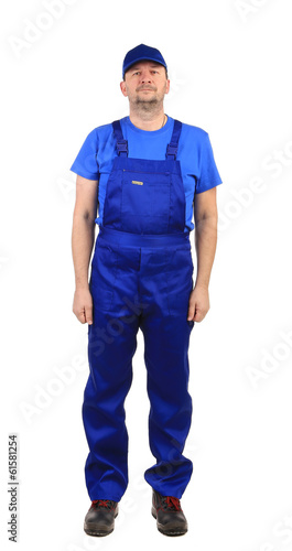 Worker in blue overalls. © indigolotos
