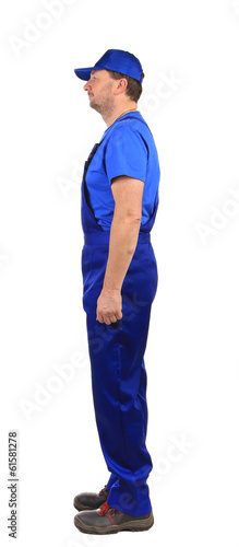 Worker in blue overalls.