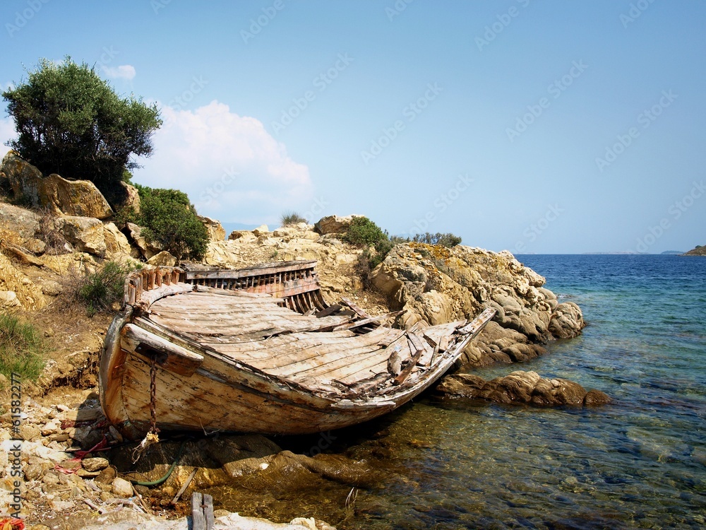 old, damaged boat on the shore in Ammouliani old, damaged boat on the shore in Ammouliani