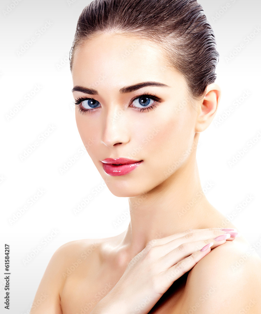 Pretty woman against a grey background Pretty woman against a grey background