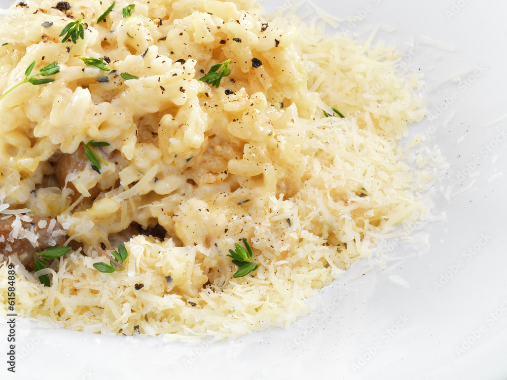 Risotto - rice cooked with broth and sprinkled with grated chees Risotto - rice cooked with broth and sprinkled with grated chees
